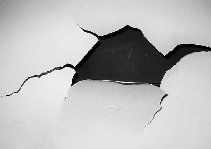 black surface white cracked paint