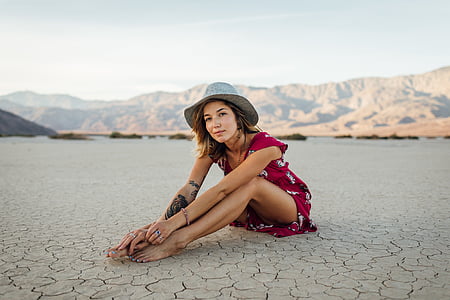 woman in gray hat sitting