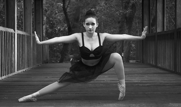 grayscale photo of female ballet dancer in dance post