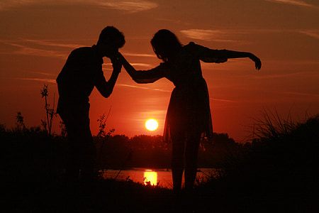 silhouettes photo of man and woman