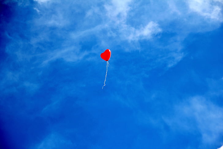 red heart balloon on air