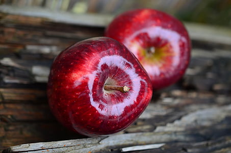 closeup photo of two red apples