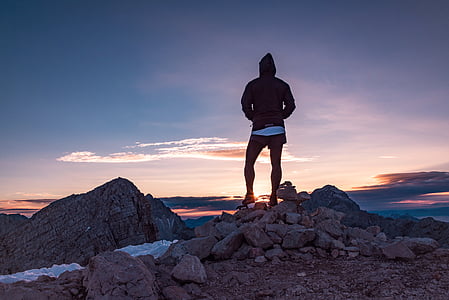 person standing on rocking ground during dawn