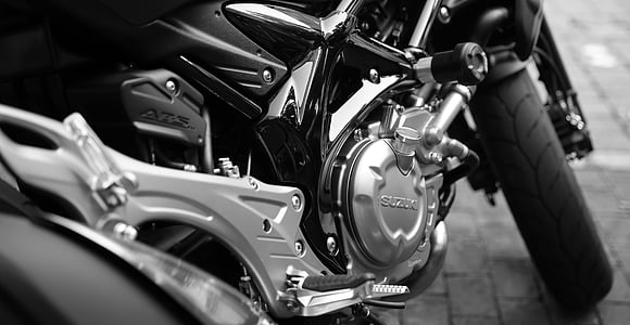 grey scale photography of Suzuki motorcycle engine