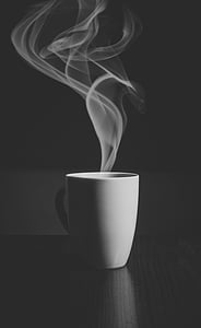 steam going out from mug grayscale photo