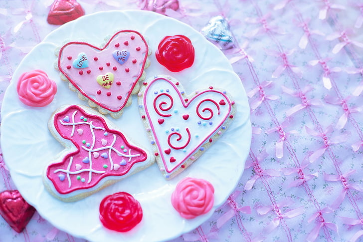 closeup photo of three heart-shaped cookies