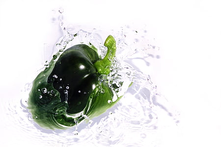 green bell pepper on water in close up photo
