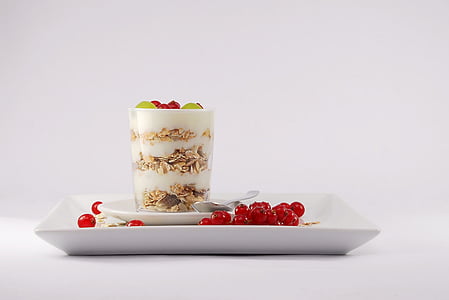desert in clear glass and square white ceramic plate