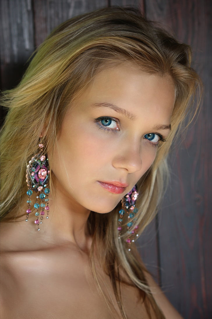 portrait photography of blonde haired woman with blue eyes