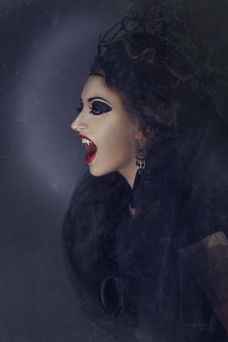 vampire woman wearing black top