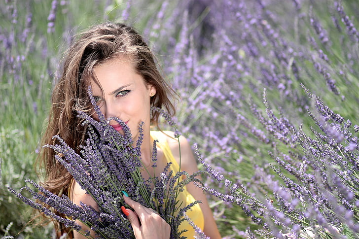woman holding purple lavender flowers