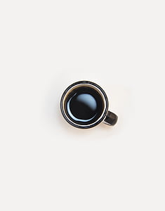 cup of coffee on white surface