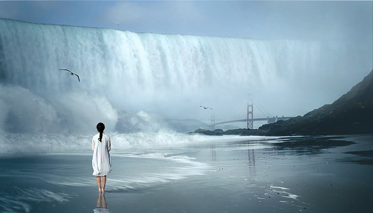 woman standing next to water falls