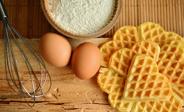 waffle, eggs, flour and whisk with chopping board