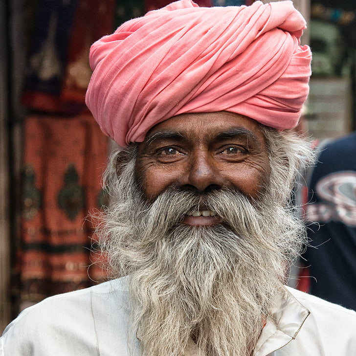 Royalty-Free photo: Focused photo of man wearing red turban and