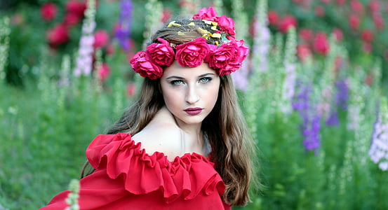 woman wearing red off-shoulder dress and rose headband