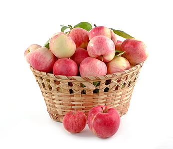 red apples in brown wicker basket