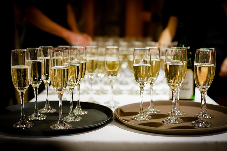 clear champagne glasses with champagne inside
