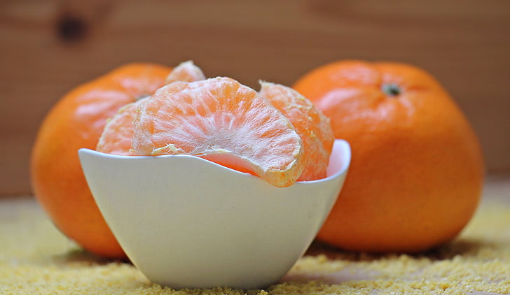 orange fruit on ceramic bowl