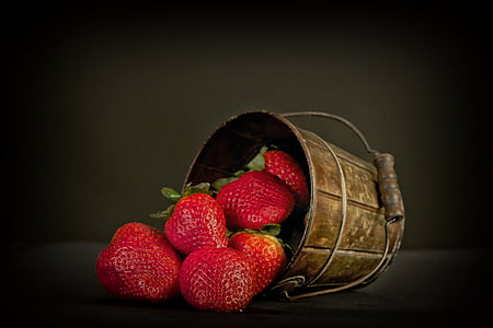strawberry on brown bucket
