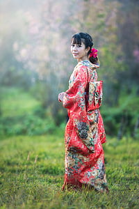 woman wearing red and green floral dress