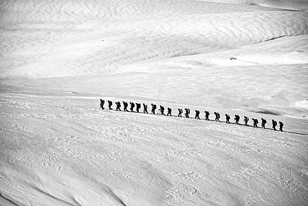 people walking on snow covered land