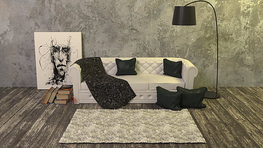 white leather 3-seat sofa with four black pillows beside the black floor lamp