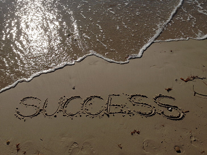 Royalty-Free photo: Gray sand with SUCCESS engraved | PickPik