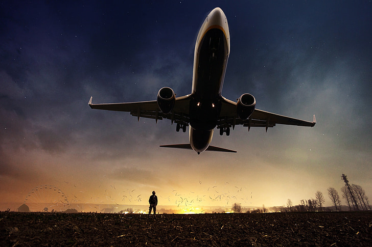 airplane flying above ground digital wallpaper