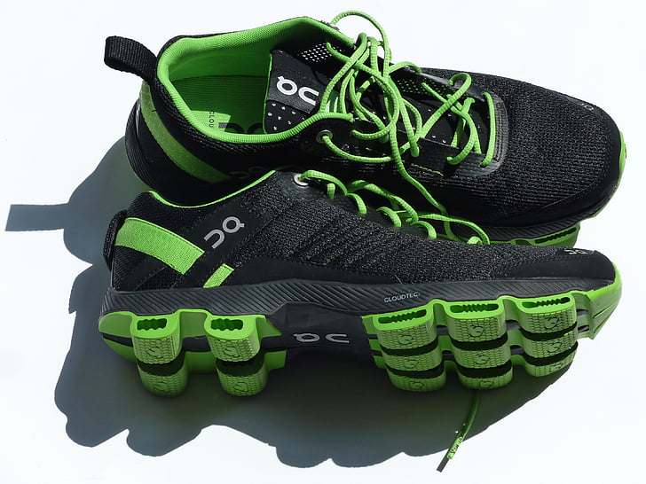 pair of black-and-green running shoes