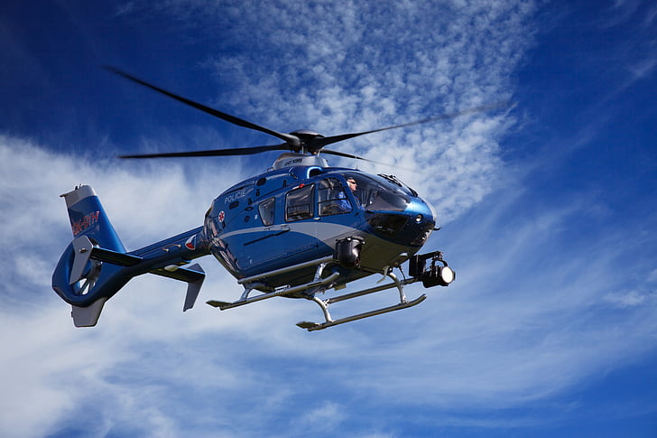 blue and gray helicopter during daytime