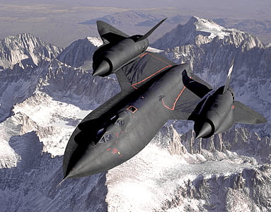 photo of black fighter jet over mountain