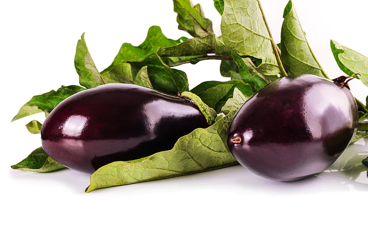 purple eggplants on white panel