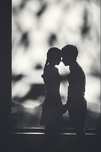 silhouette of couple grayscale photo