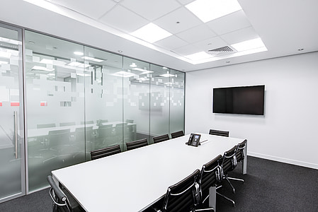 conference room with black flat screen TV mounted on the wall
