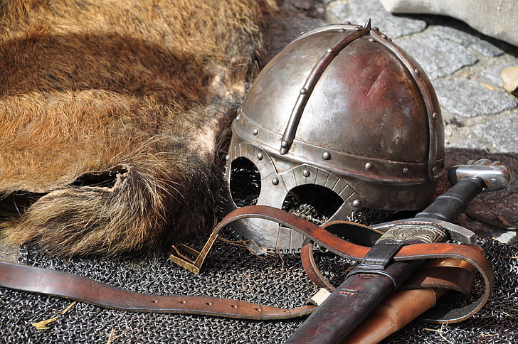 closeup photo of sword and helmet