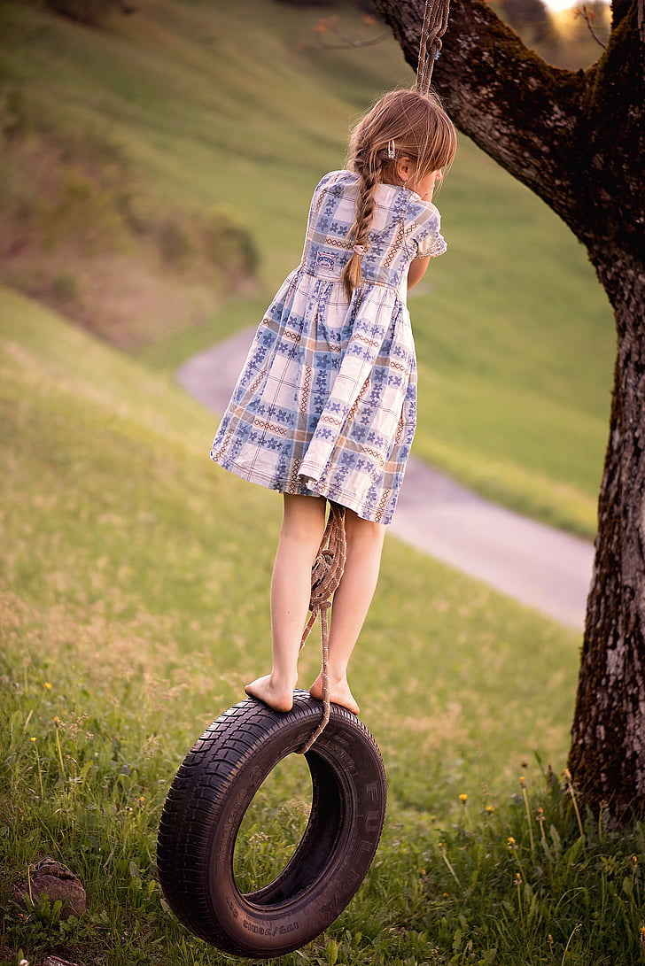 girl ride on vehicle tire swing