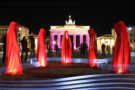 people wearing red robes during night time