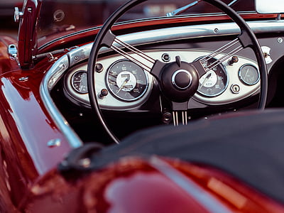 selective photo of a black car steering wheel