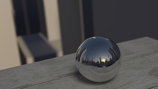 silver ball decor on top of gray wooden surface