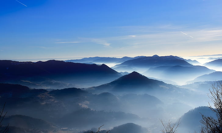 mountains with fogs at daytime