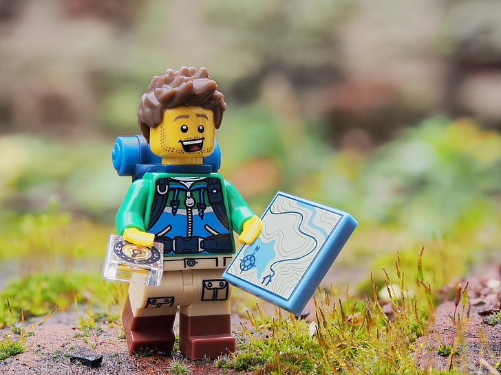shallow focus photography of hiker LEGO plastic toy