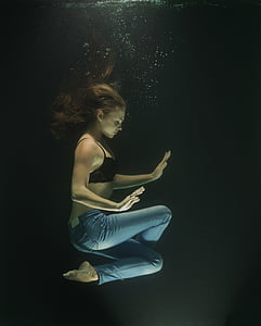 woman meditating underwater