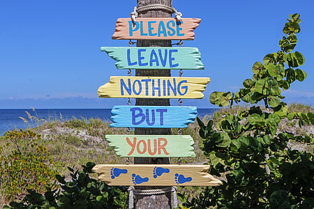 closeup photo of Please Leave Nothing But Your Foot Prints sign