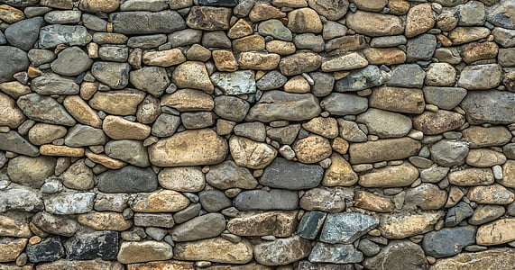 photo of brown and black stone wall