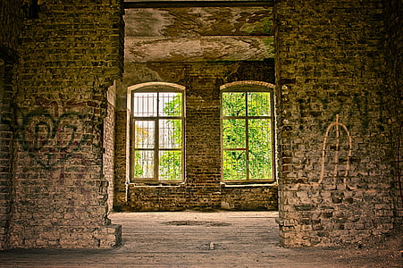 two glass window between brick pillars