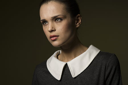 woman wearing white and black collared top