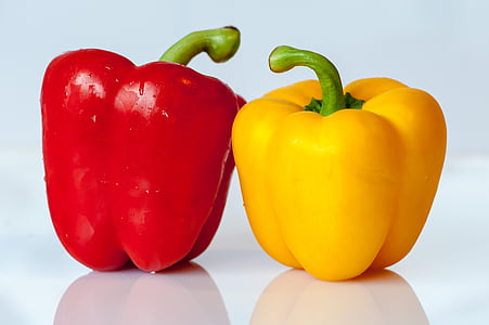 two red and yellow bell peppers