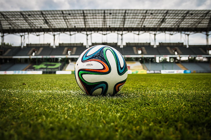 soccer ball on soccer field at daytime
