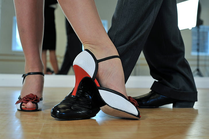 woman wearing white and black peep-toe heels